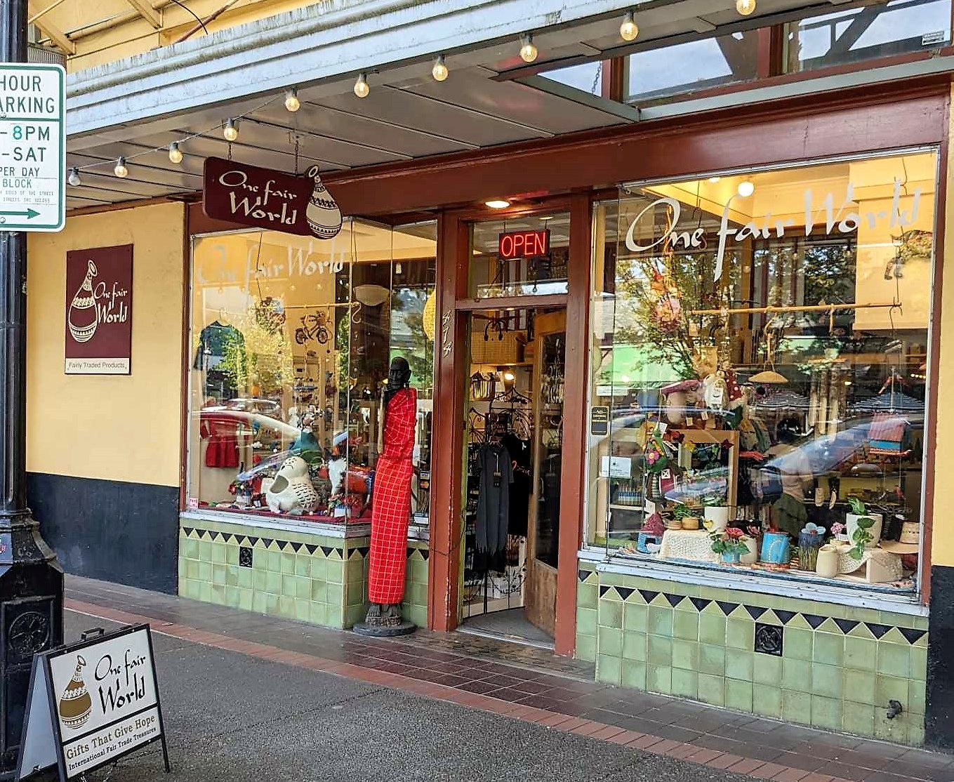 One Fair World's Storefront Outside view of One Fair World's Storefront at 474 Court St NE Salem, OR with wooden elder Maasai figure outside the door.